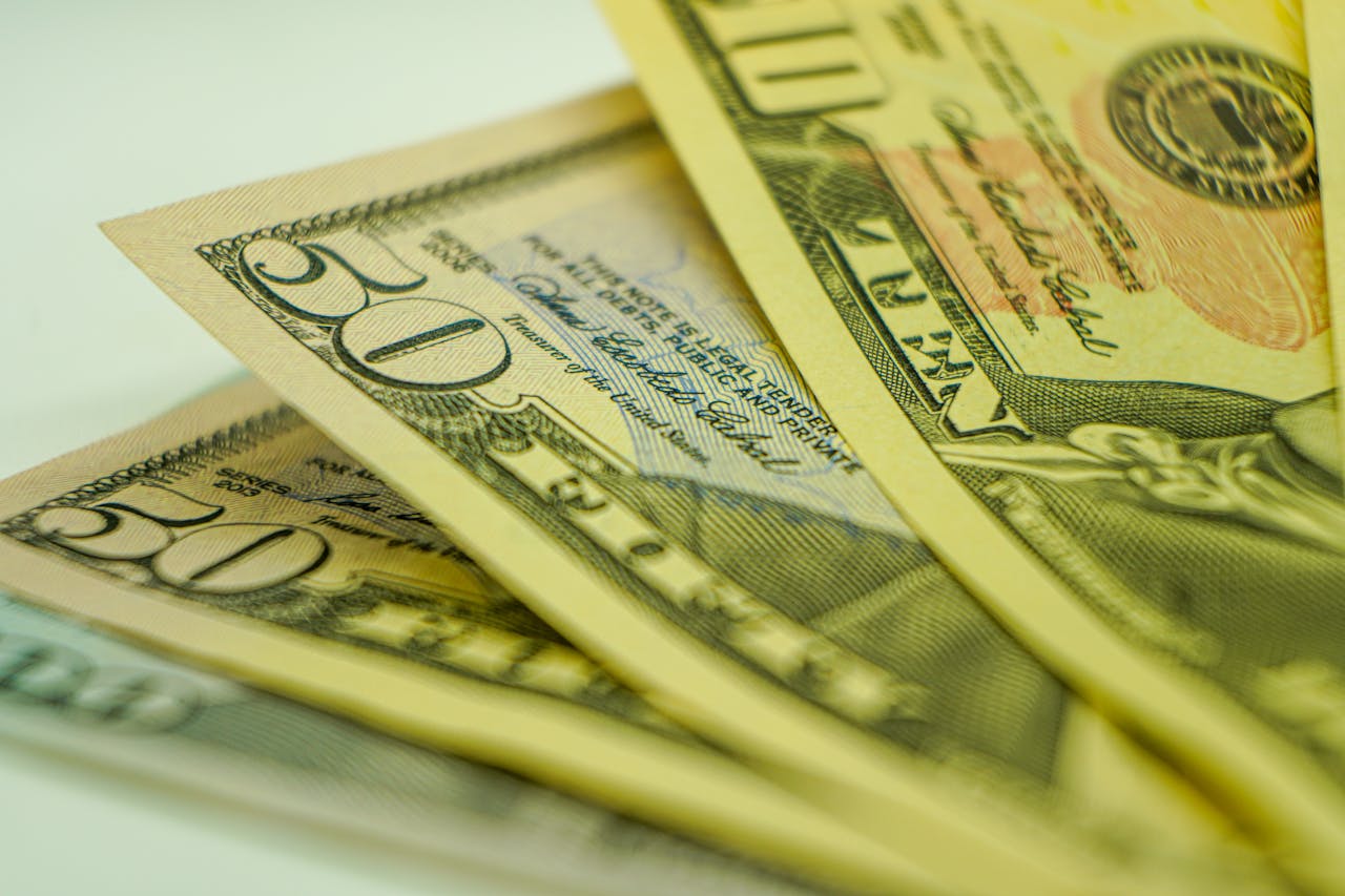 Macro shot of American dollar bills displaying currency detail for finance-related concepts.