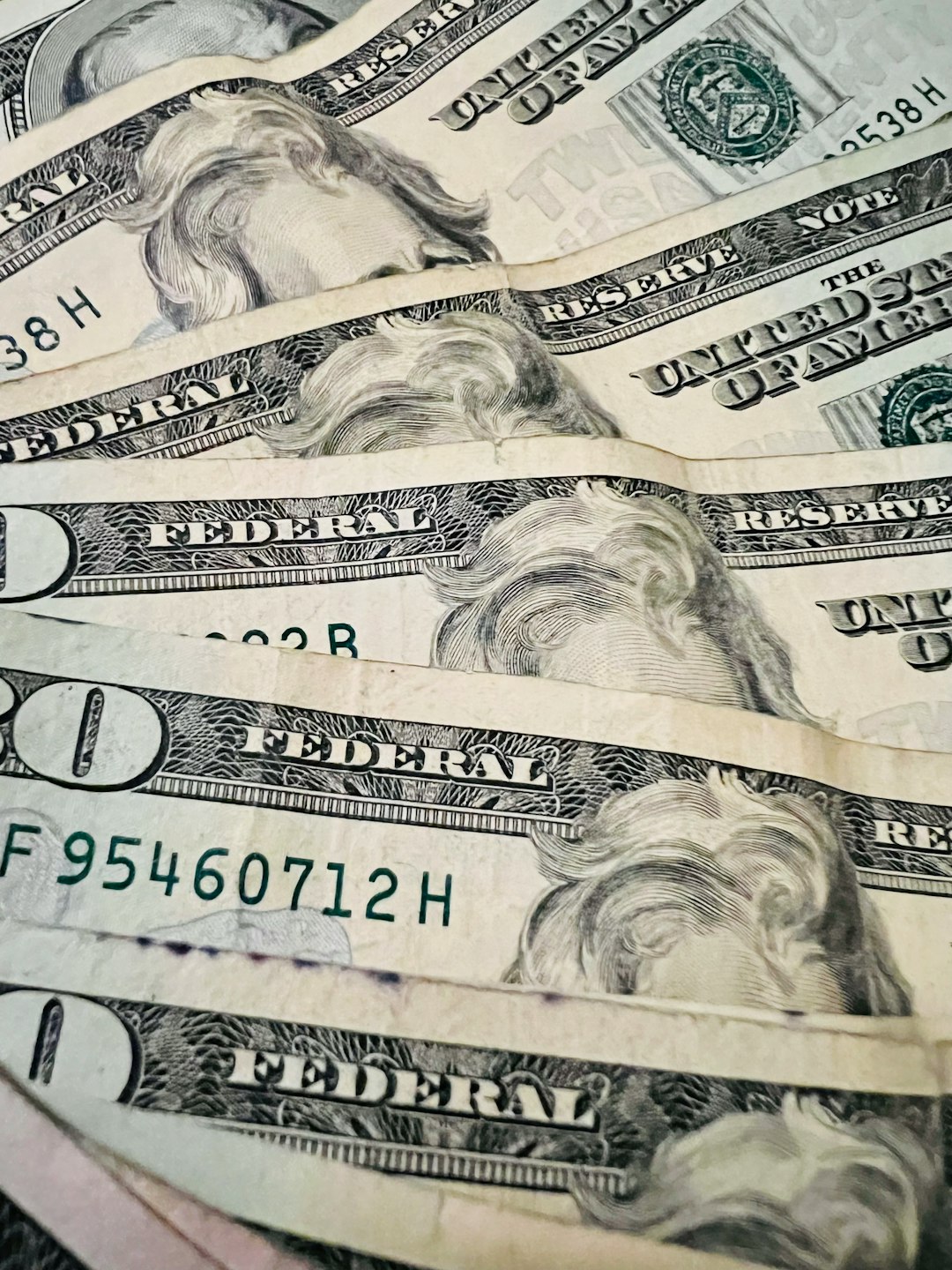 Dollar bills, Jefferson, 20 dollar bills and a single 100 bill. Non mint condition